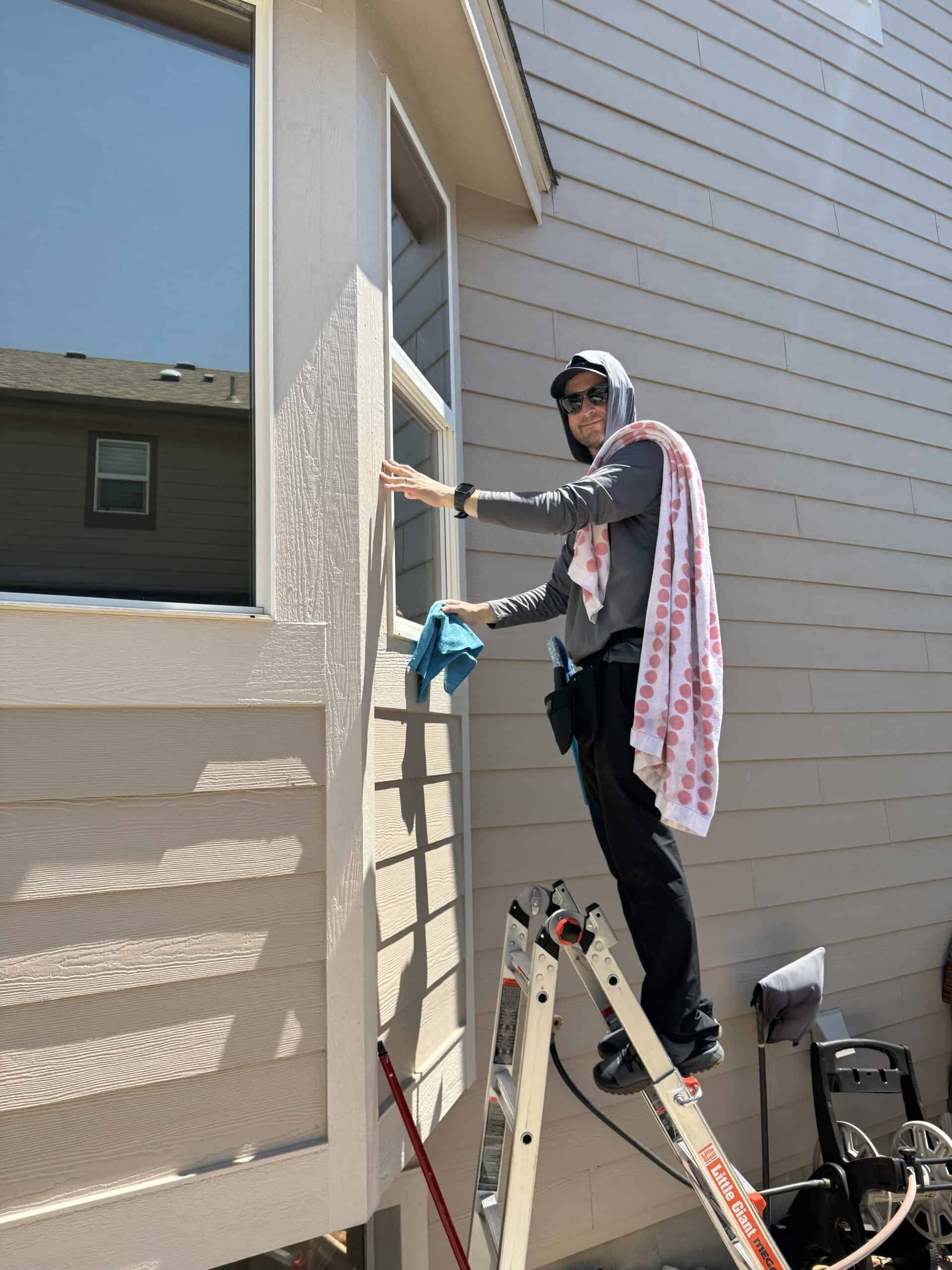 Technician performing window cleaning Longmont CO