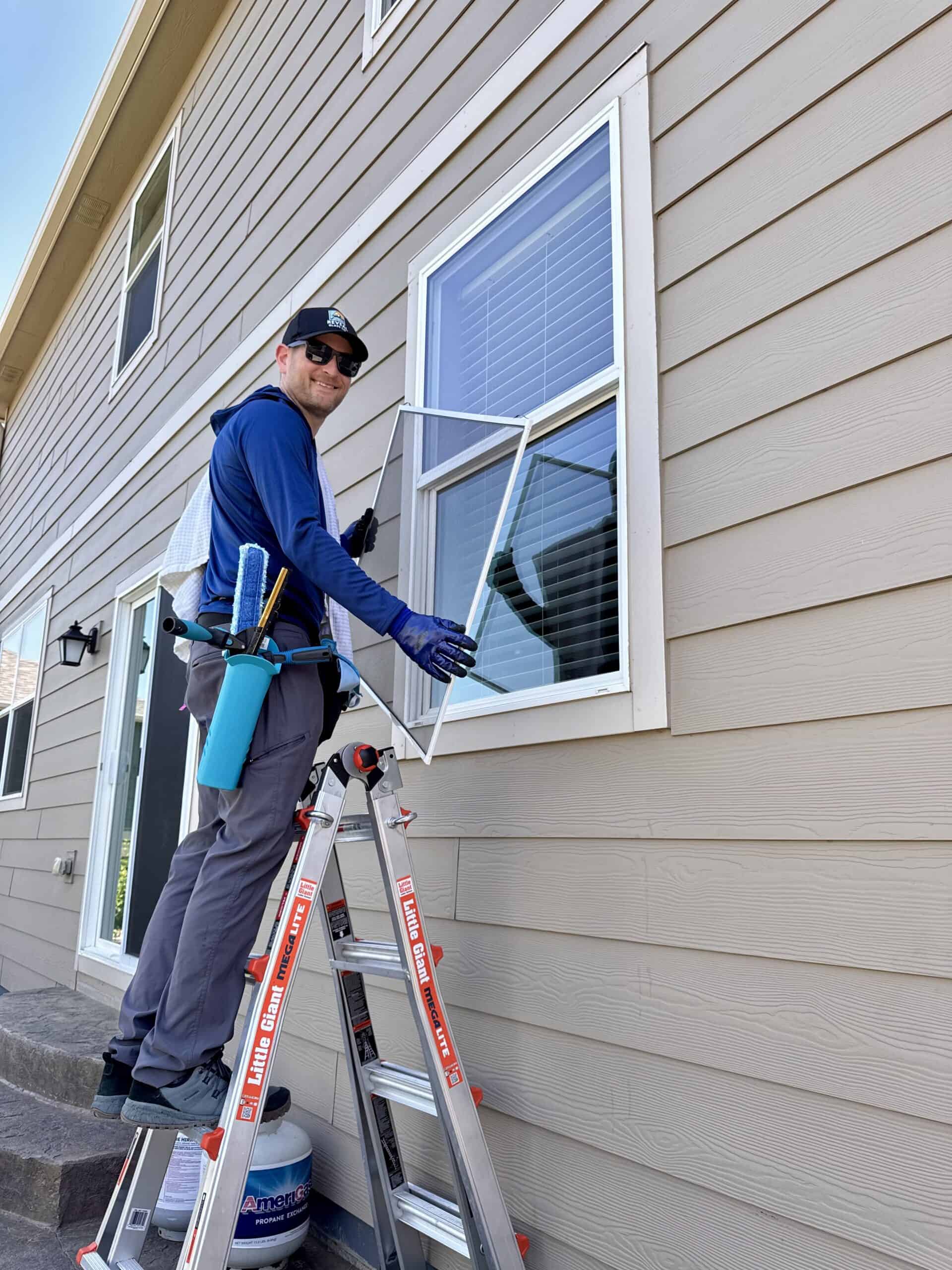 Technician performing window cleaning Longmont CO